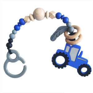 Attache jouet tracteur bleu